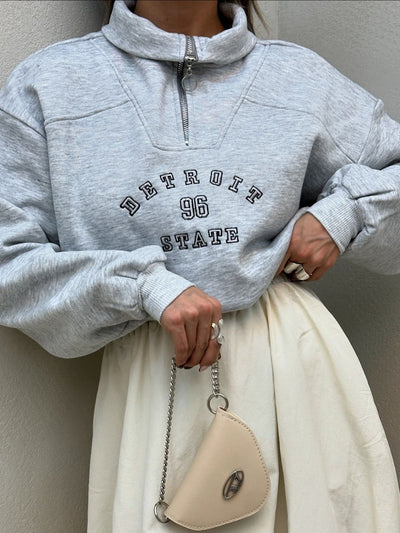 Urban Zip-Collar Embroidered Top