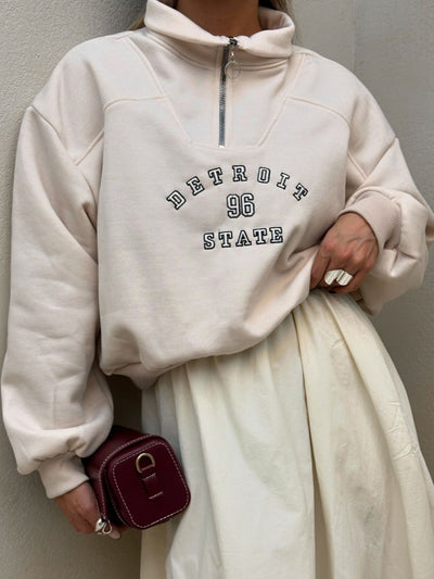 Urban Zip-Collar Embroidered Top